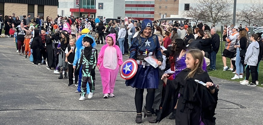 KIDS IN COSTUMES WALKING IN PARADE